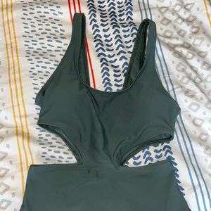 Aerie Onepiece khaki green bathing suit with rib cage cut outs.